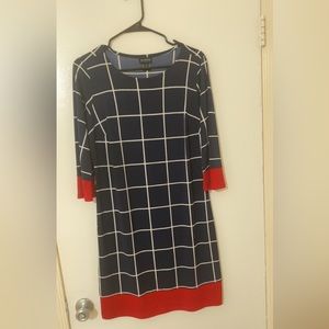 It’s Red at the bottom and the end of the sleeves.